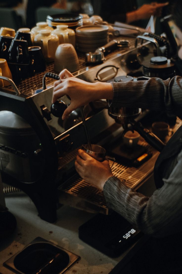 Barista pouring coffee