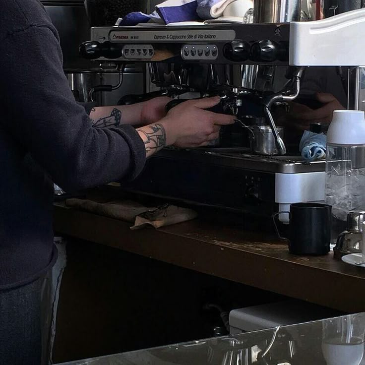Barista steaming milk